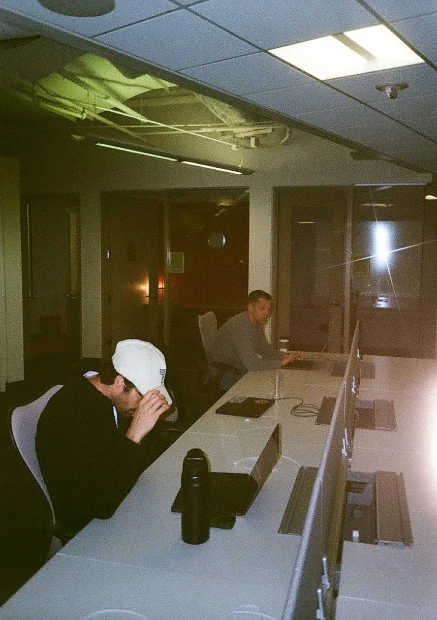Thread teammates working at a row of desks in a shared office.